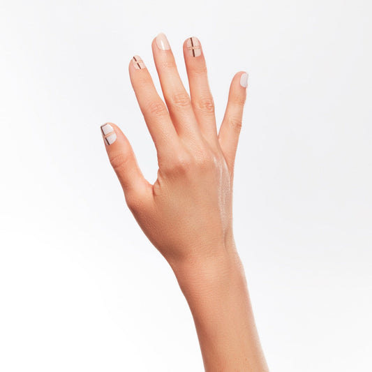 A hand of a lady wearing nail strips from Ardell collection.