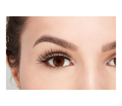 A model with an open right eye wearing Ardel Double Wispies showing how it looks like when wearing