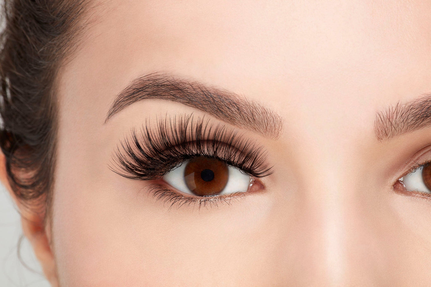 Close-up of Ardell 3D Faux Mink lashes on model, showcasing full volume, soft texture, and dramatic length.