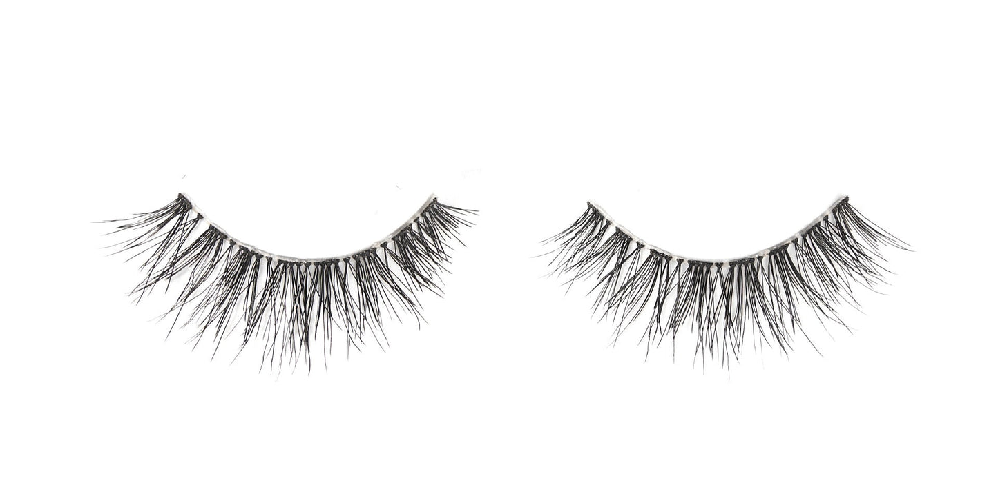 A single pair of Ardell Naked Lashes 425 featuring its multi-layered & short layered lashes isolated in white color setting