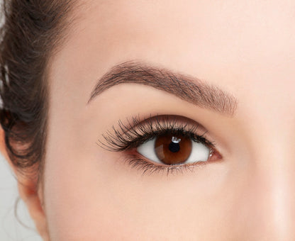 A model with an open right eye wearing Ardell Natural 120 showing how it looks like when it's worn